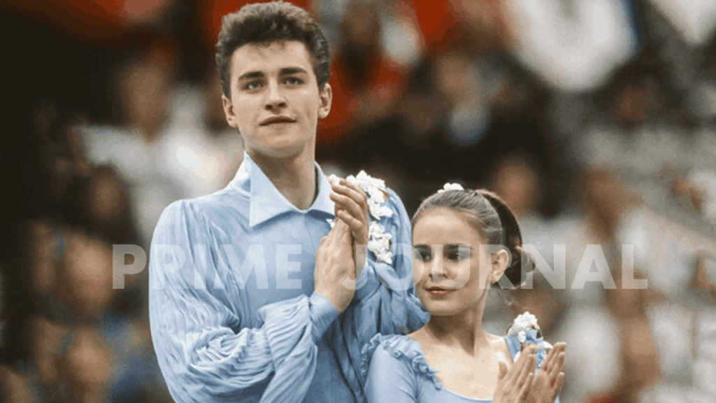 Ice skaters in blue costumes applauding.